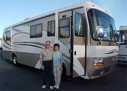 Two happy clients standing in front of there new Monaco RV purchased at Pedata RV